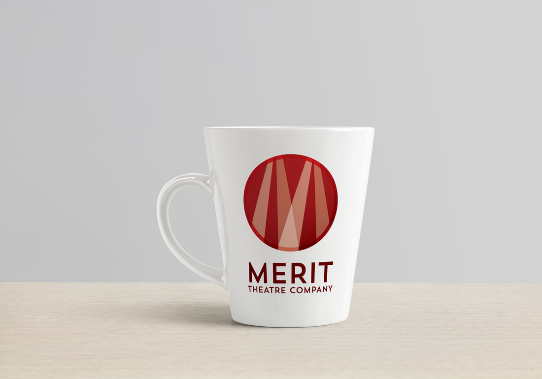 Merit Theatre Company logo on a white mug against a grey background